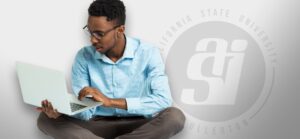 Male student on a laptop
