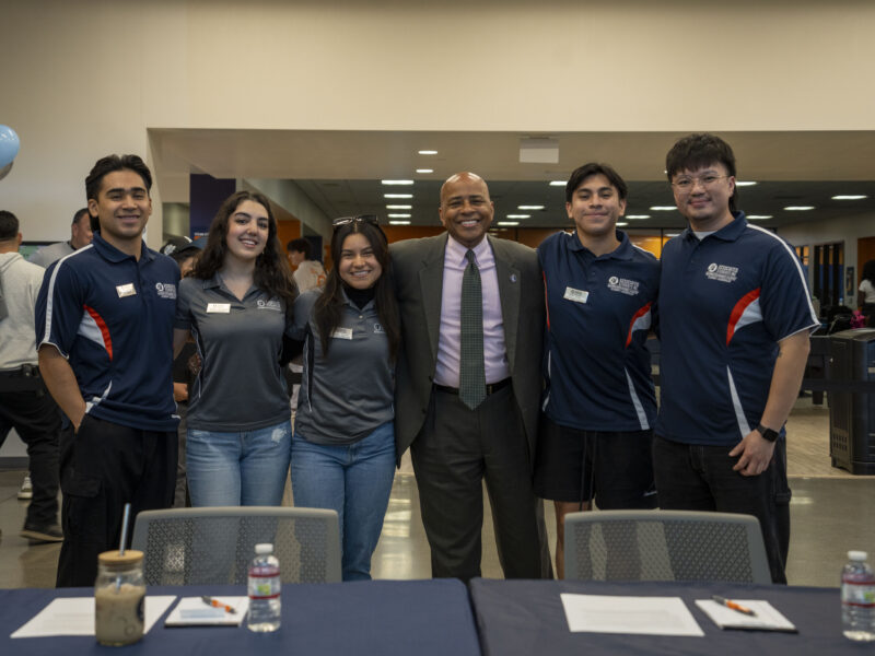 ASI Student leaders and President Rochon pose for a photo