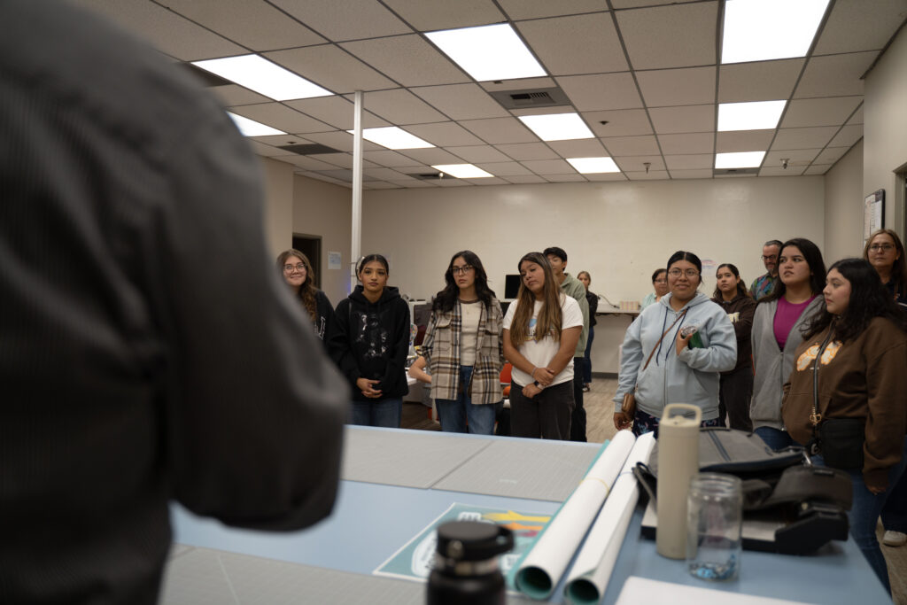 The students of El Modena High School listening to Michael Greenlee lead a presentation. 