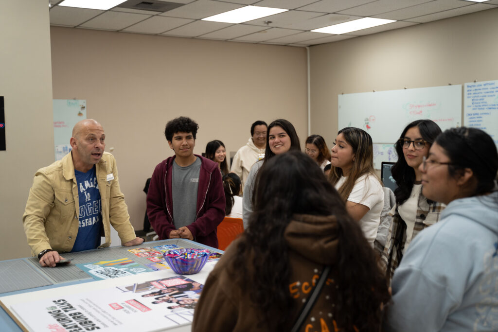 The students of El Modena High School listening to Michael Fratino give advice. 