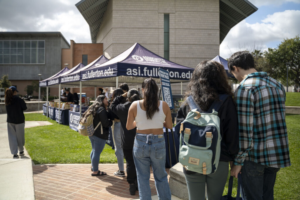 Food Pantry patrons lining up outside of ASI tent 