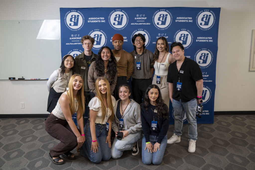 ASI student employees pose with Tyler James Williams. 