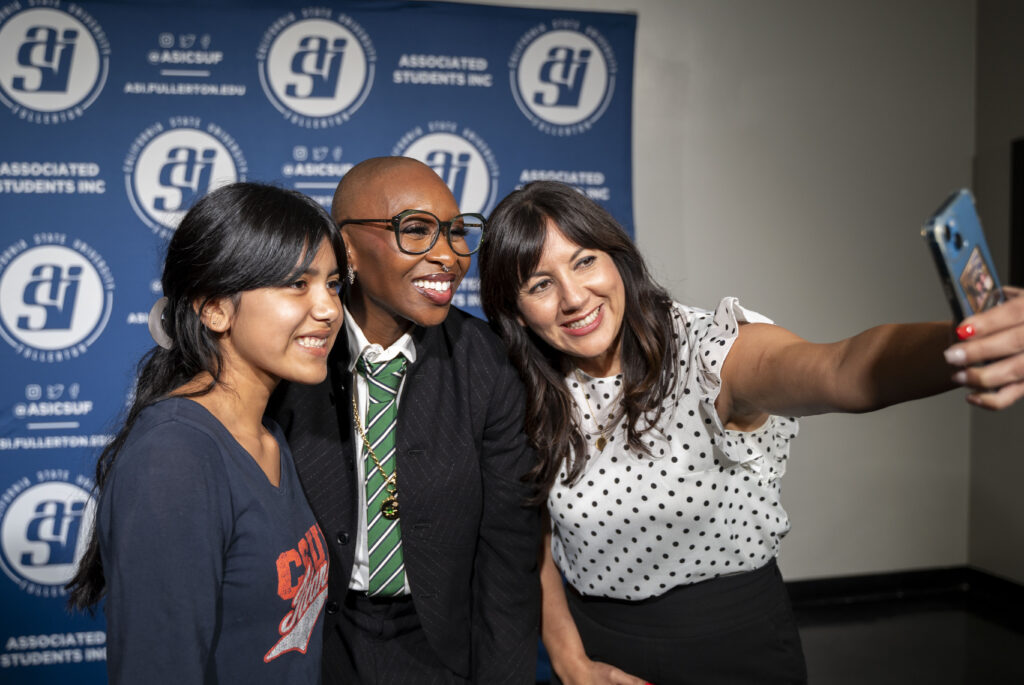 People pose for a picture with Cynthia Erivo during the Beyond the Conversation event. 