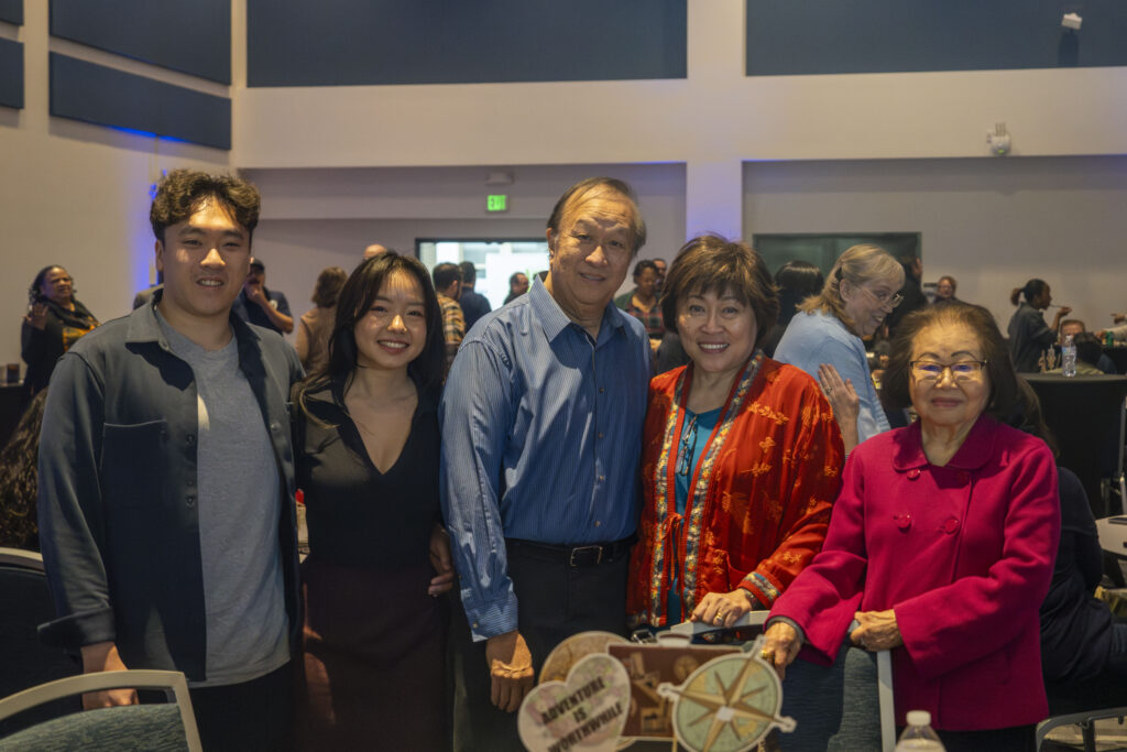 a smiling family standing together