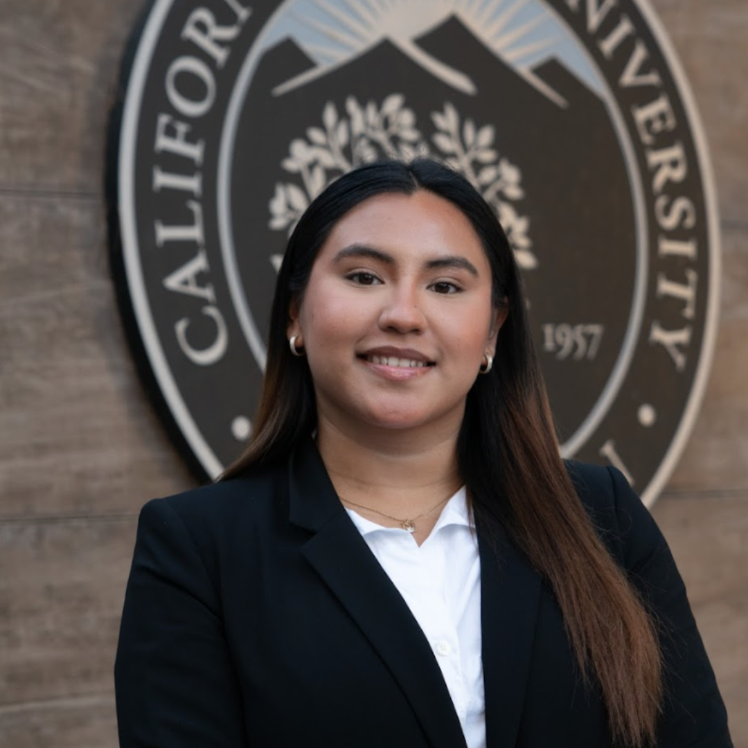 a woman in a suit smiling