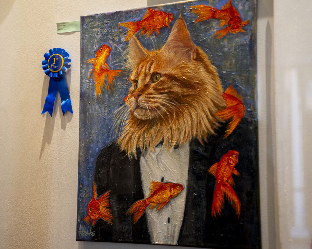 painting on wall, cat in a suit