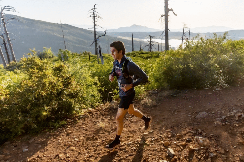 man running on dirt trail