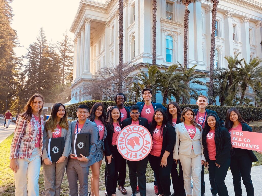 group of people outside posing for picture