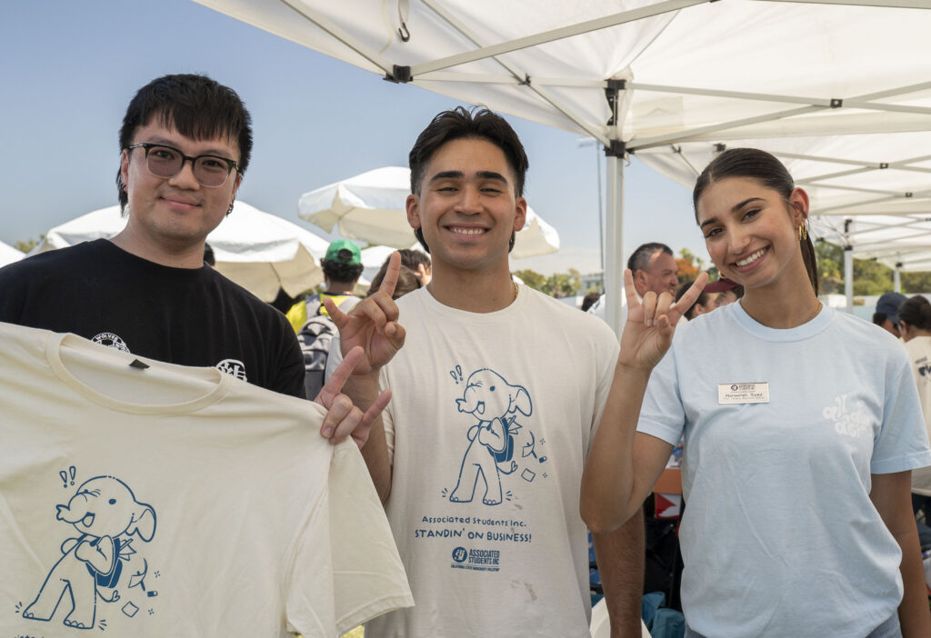 a group of students smiling and posing for a picture 