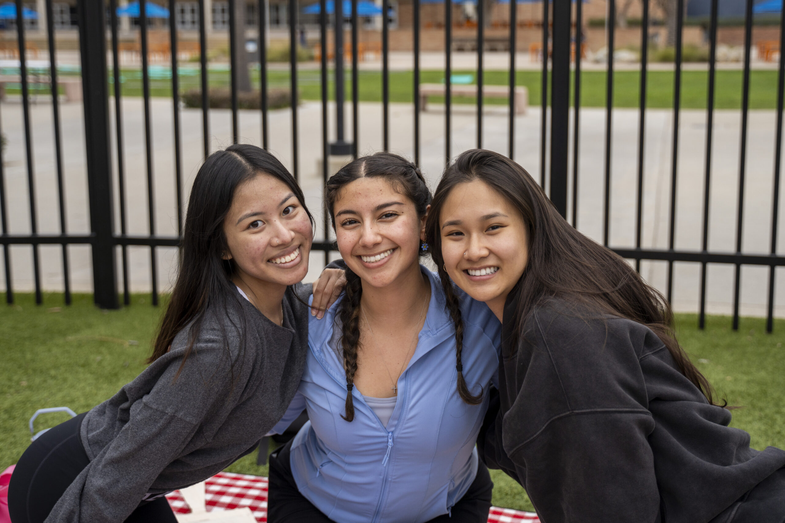 a group of girls smile and pose for a photo