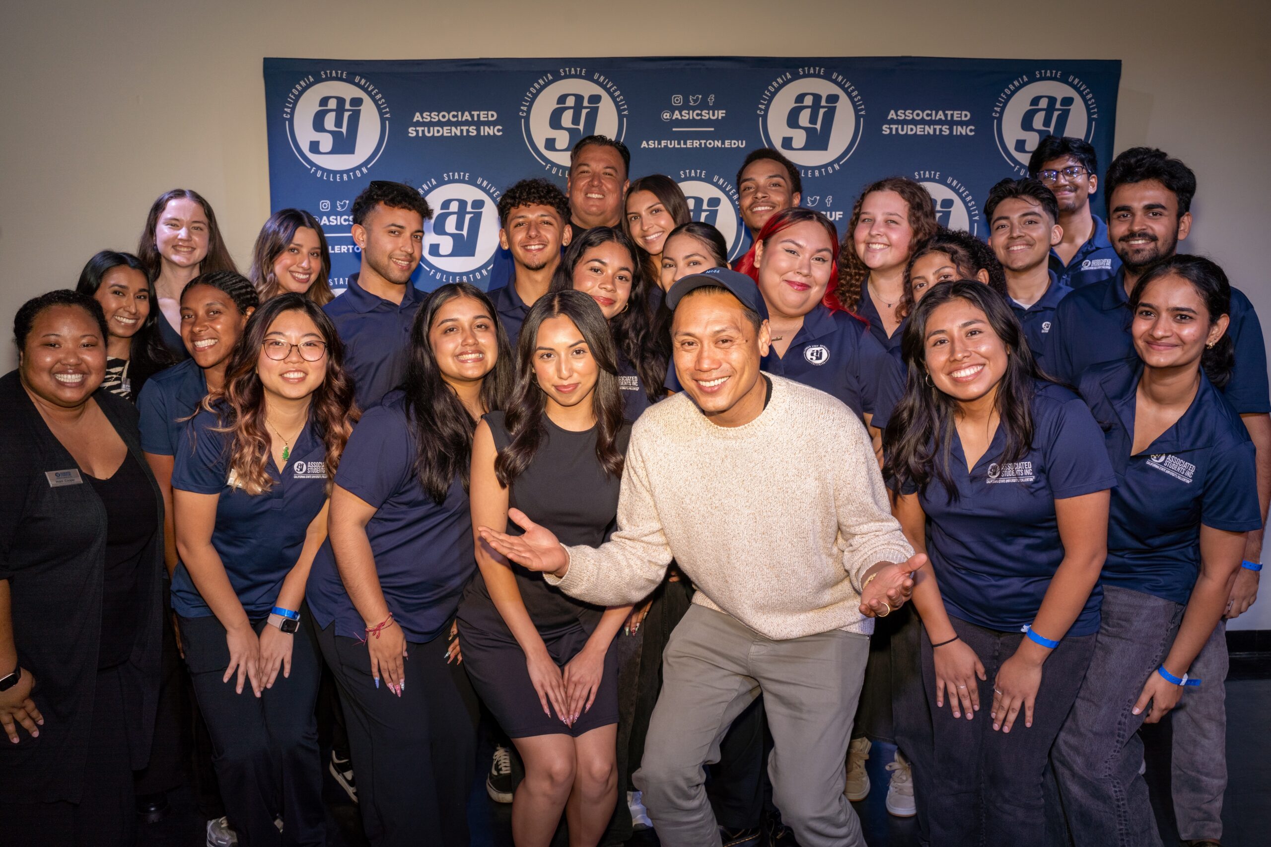Jon M. Chu poses with a group of students