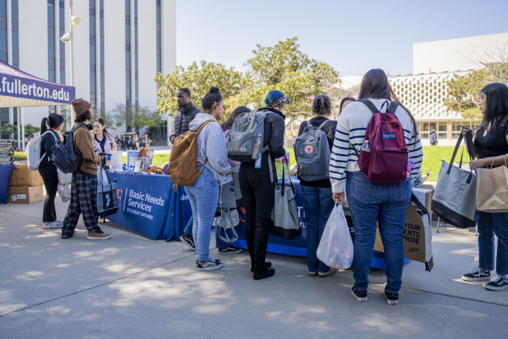 a group of students gathered around a table 