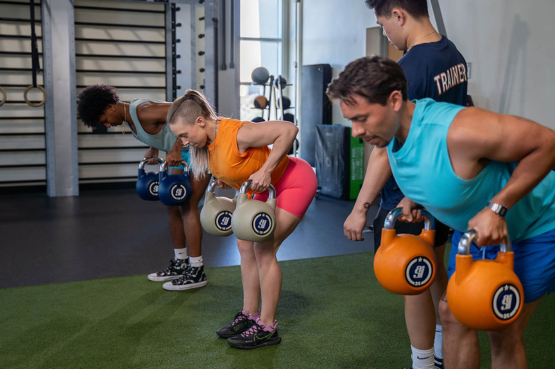 SRC employees using kettlebells at the student recreation center