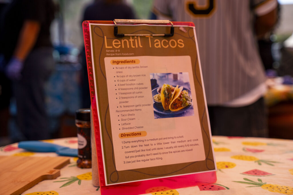 a sheet with directions on how to make lentil tacos sits on a table