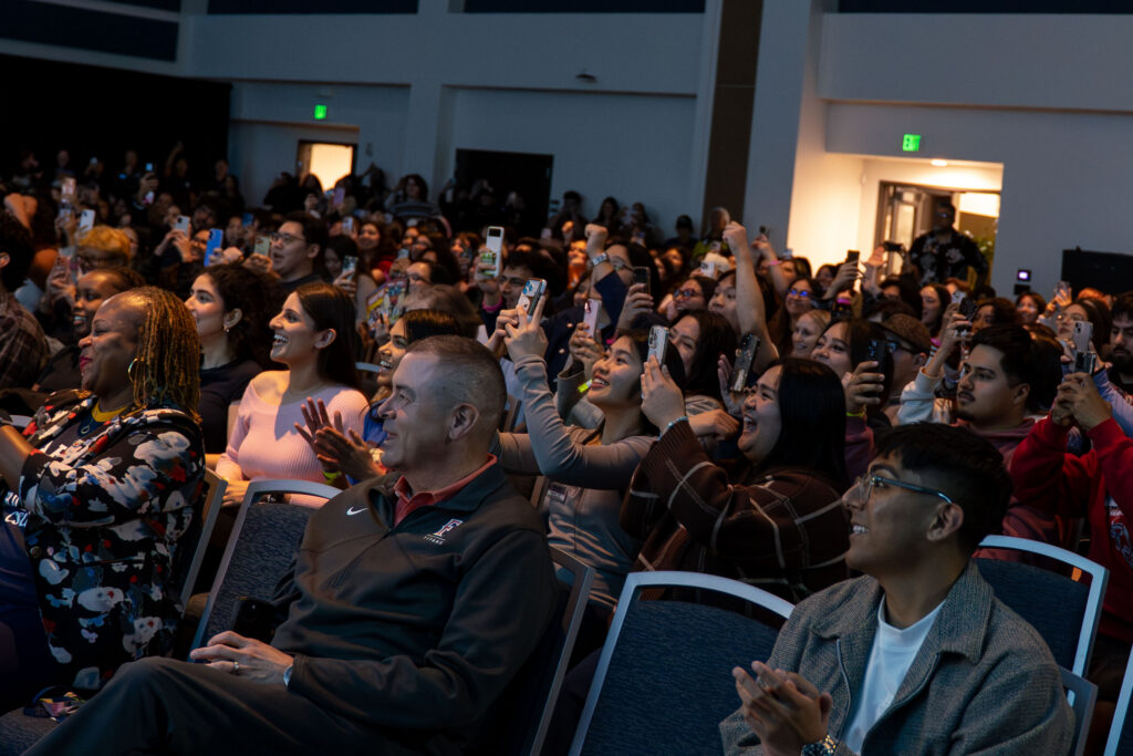 Students holding their phones up.