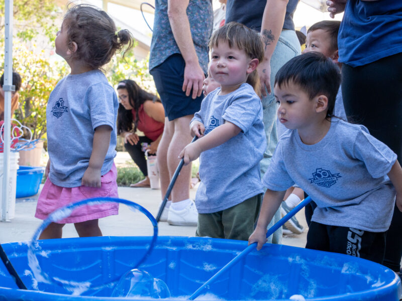 Children playing in bubbles
