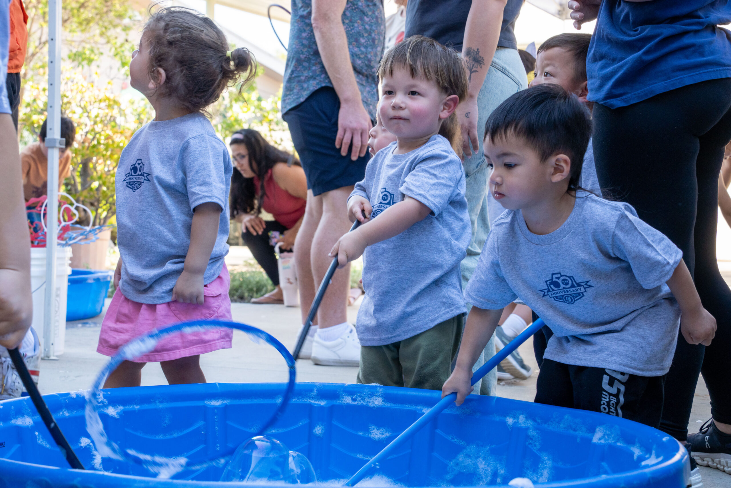 Children playing in bubbles