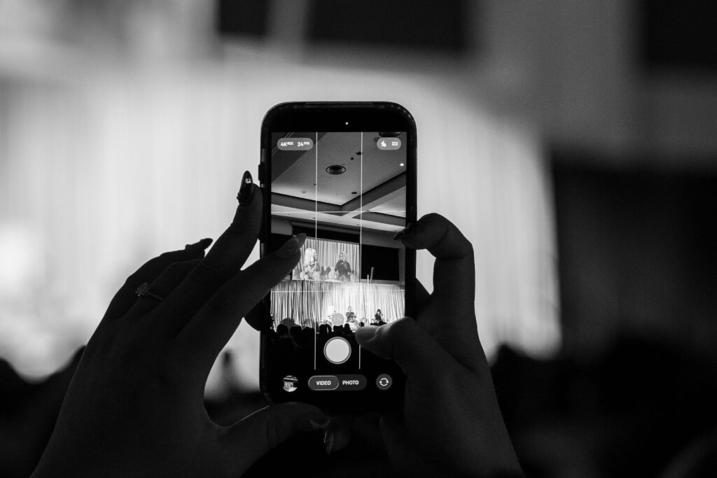 a black and white photo of a phone taking a picture 