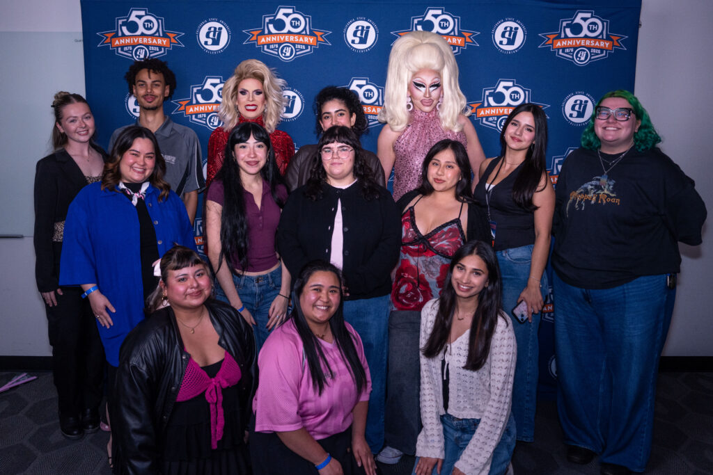 trixie and katya posing for a picture with students