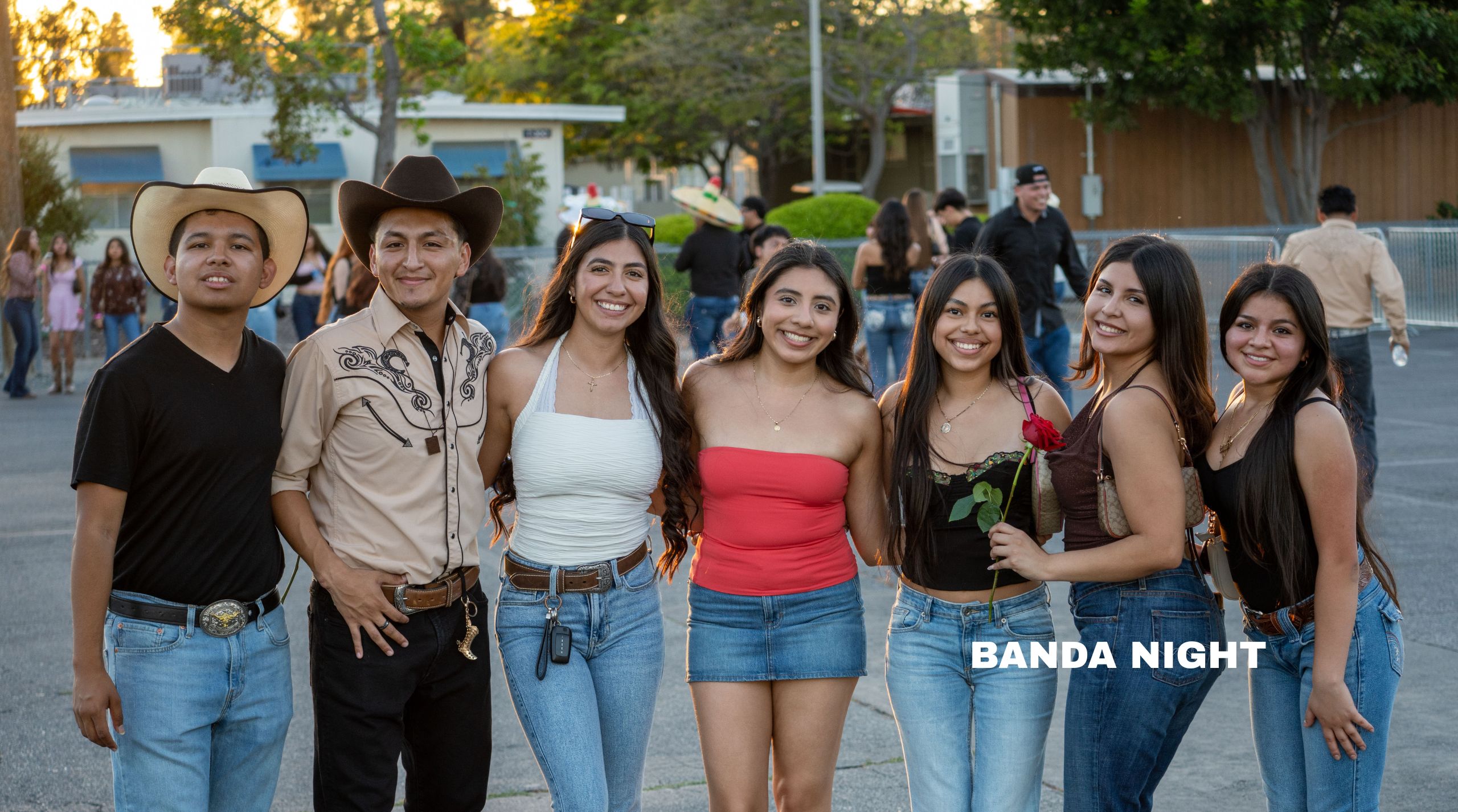 a group of young women and man in cowboy hats and boots pose for a picture