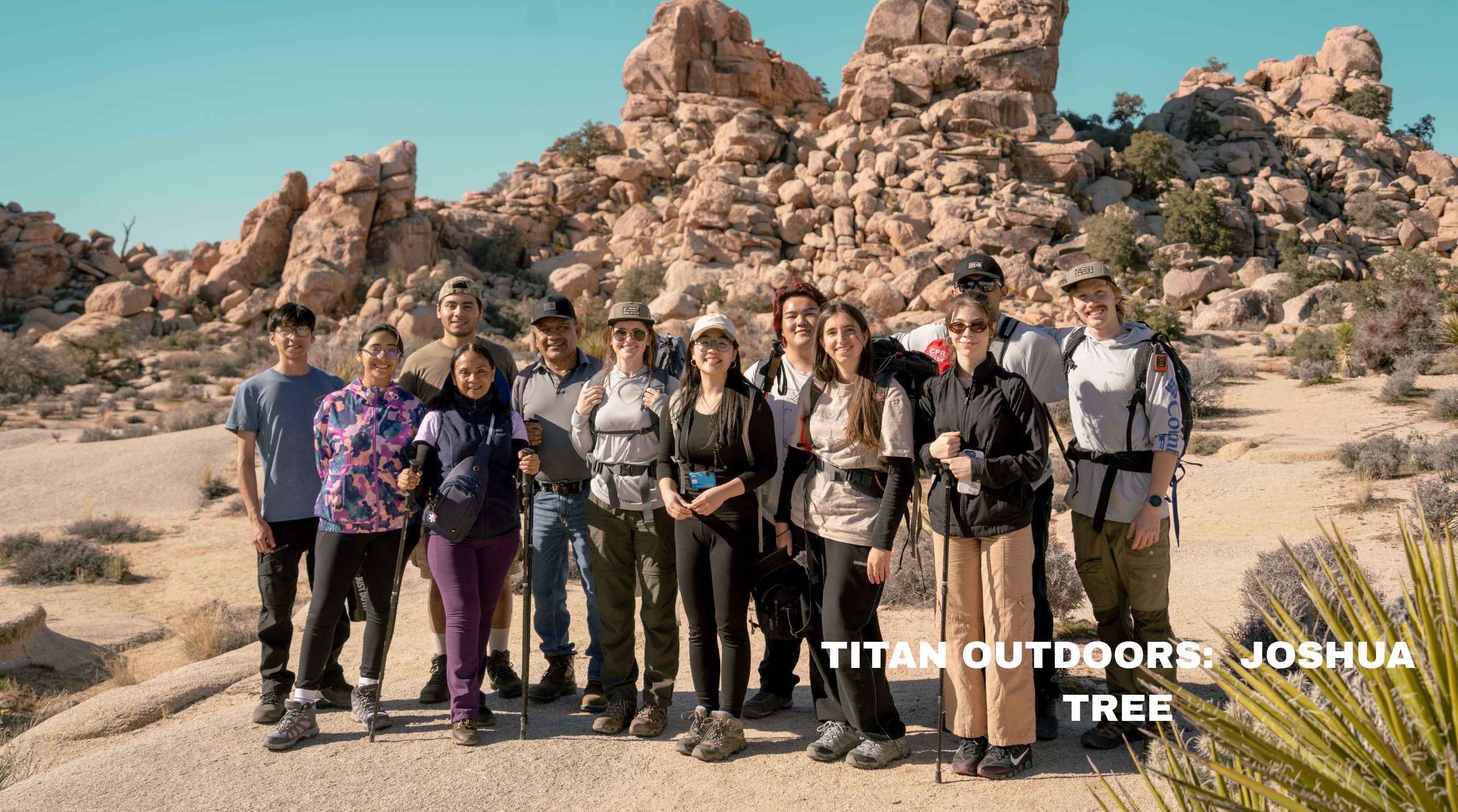 a group of people posing outdoors for a picture
