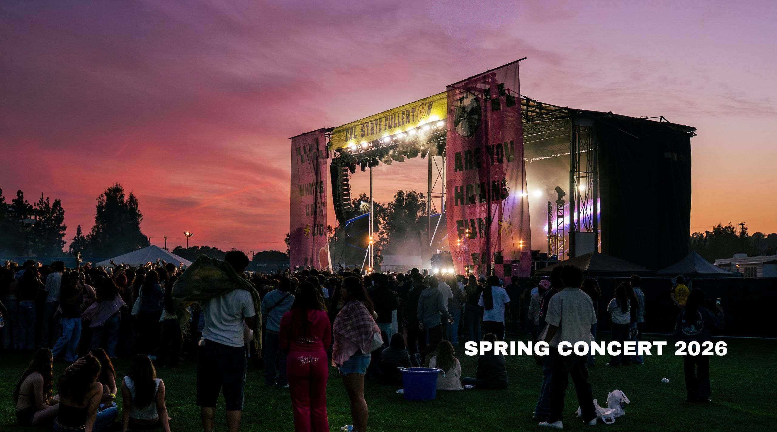 a sunset image with a concert in the foreground