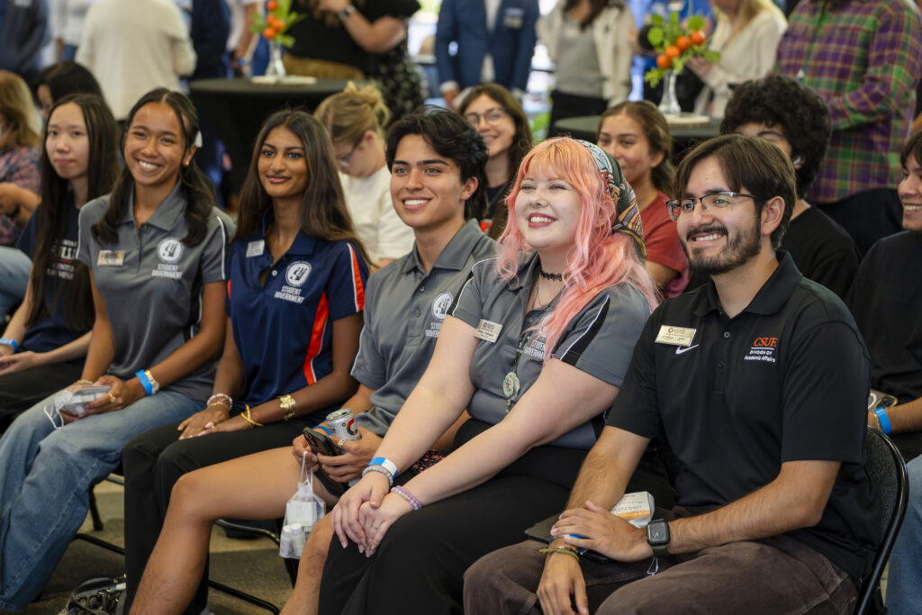 a group of students sitting in chairs